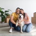 Couple moving house with a dog
