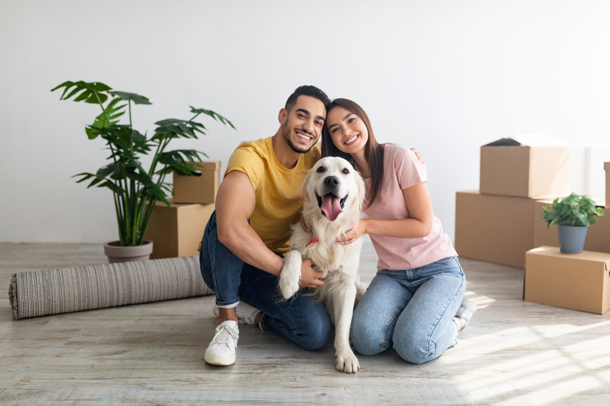 Couple moving house with a dog