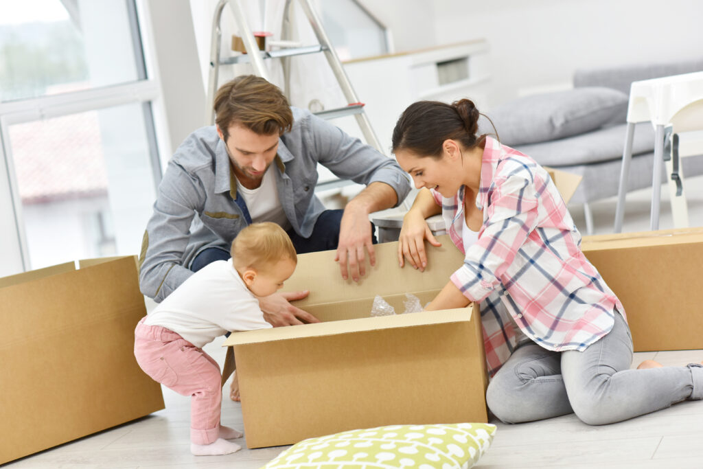 Baby-playing-with-box-bassys-removals